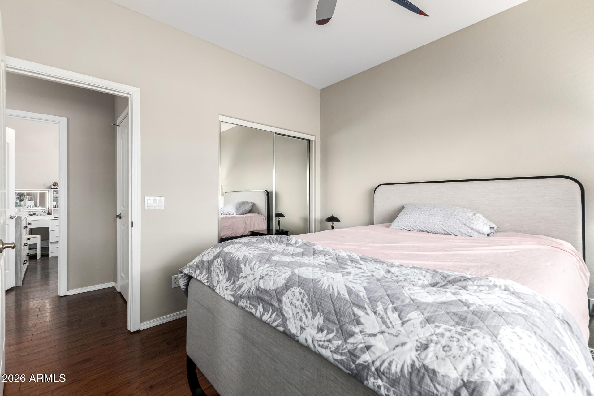 24541 Plum Road Florence, AZ 85132 - Photo 24 of 47 a bedroom with a bed and wooden floor