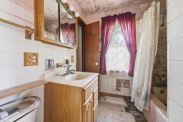a utility room with a sink dryer and washer