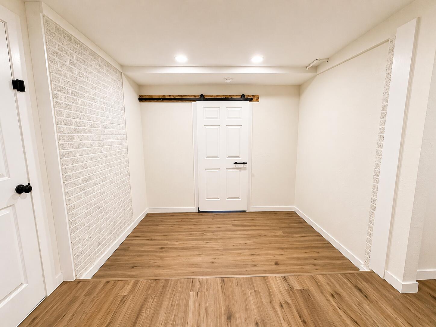 2316 48th Street Lubbock, TX 79412 - Photo 11 of 18 a view of a room with wooden floor and white wall