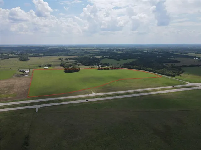 an aerial view of a golf course with houses