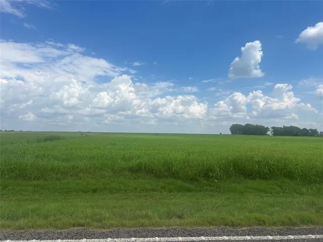 a view of a golf course with a lake