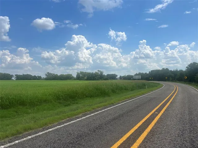 a view of a big yard of a house with a big yard