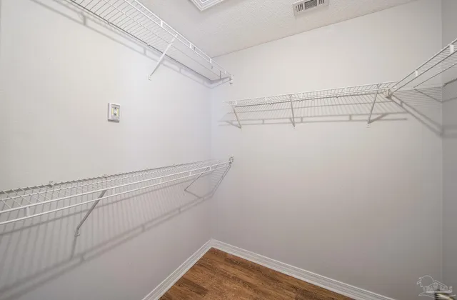 a view of a room with racks on the wall