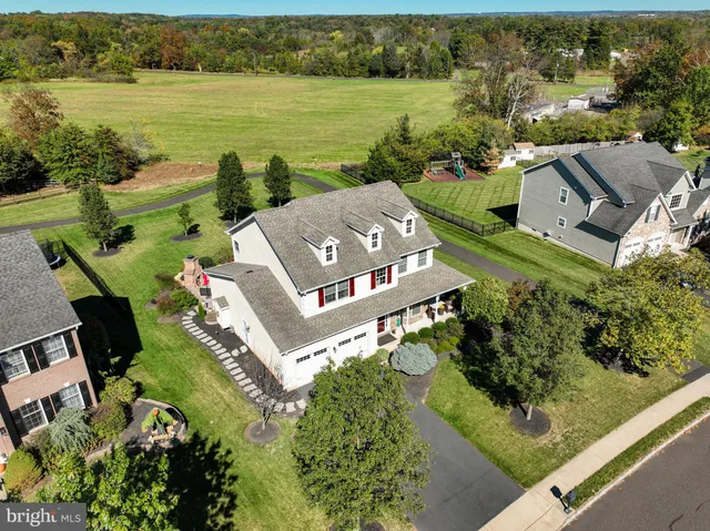an aerial view of a house with a lake view