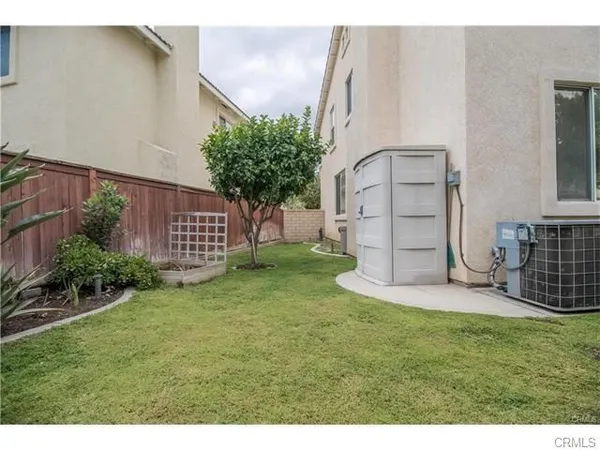 a view of a back yard of the house