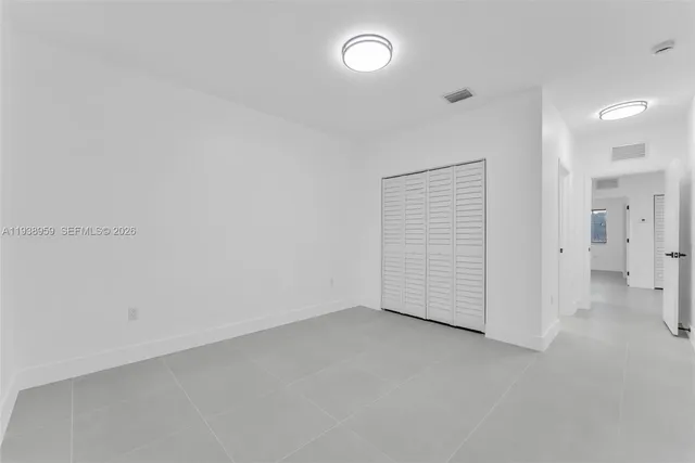 an empty room with a bathroom