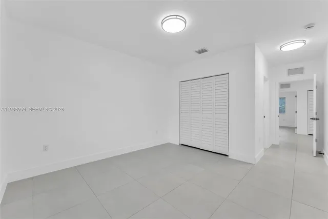 an empty room with a bathroom