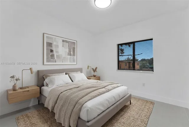 a bedroom with a bed and a couch