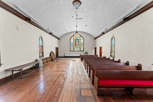a room with lots of trees and furniture