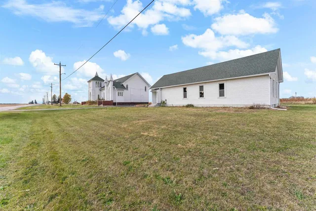 a big room with yard and a garage