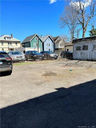 a view of a house with wooden fence