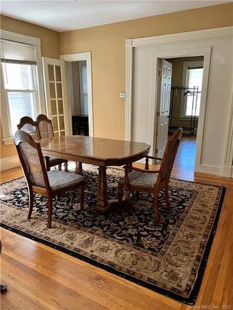a dining room with furniture and window