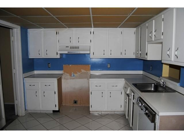 3976 Inverrary Drive, Unit C4 Lauderhill, FL 33319 - Photo 4 of 11 a kitchen with cabinets appliances and a counter space