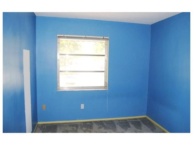 3976 Inverrary Drive, Unit C4 Lauderhill, FL 33319 - Photo 7 of 11 a view of an empty room with a window