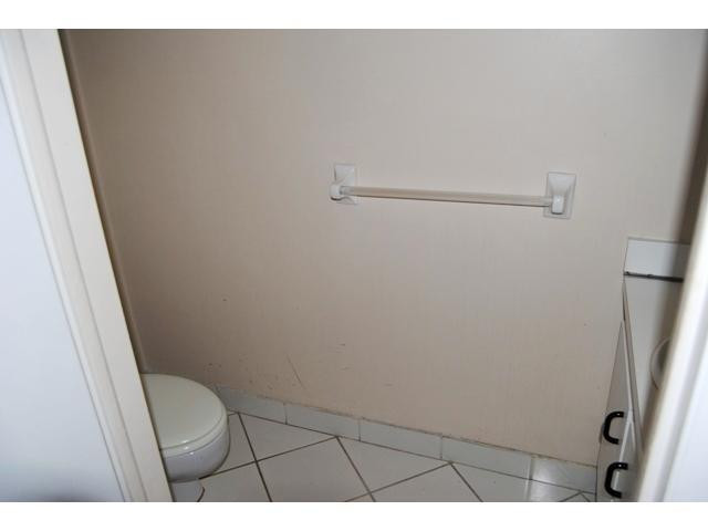 3976 Inverrary Drive, Unit C4 Lauderhill, FL 33319 - Photo 8 of 11 a bathroom with a toilet and a sink
