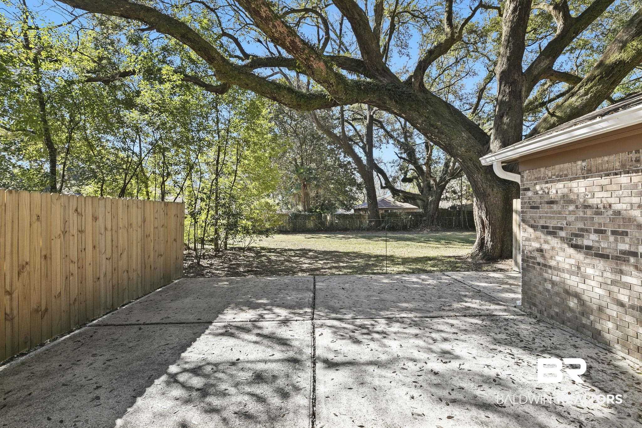 5817 Woodgate Road Mobile, AL 36609 - Photo 68 of 85 View of patio featuring a fenced backyard