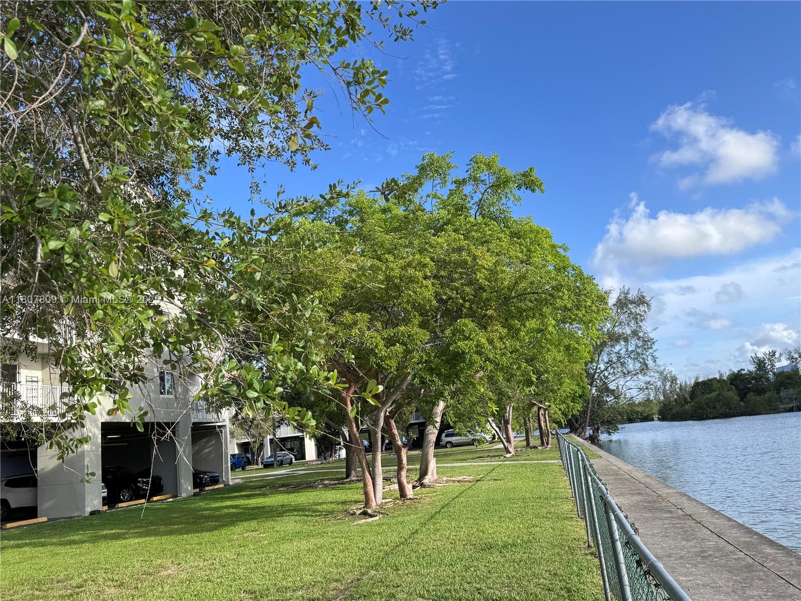 8260 Southwest 210th Street, Unit 310 Cutler Bay, FL 33189 - Photo 11 of 14 front view of a house with a tree