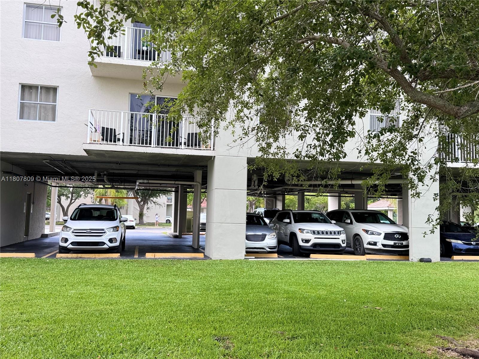 8260 Southwest 210th Street, Unit 310 Cutler Bay, FL 33189 - Photo 13 of 14 a house view with a garden space