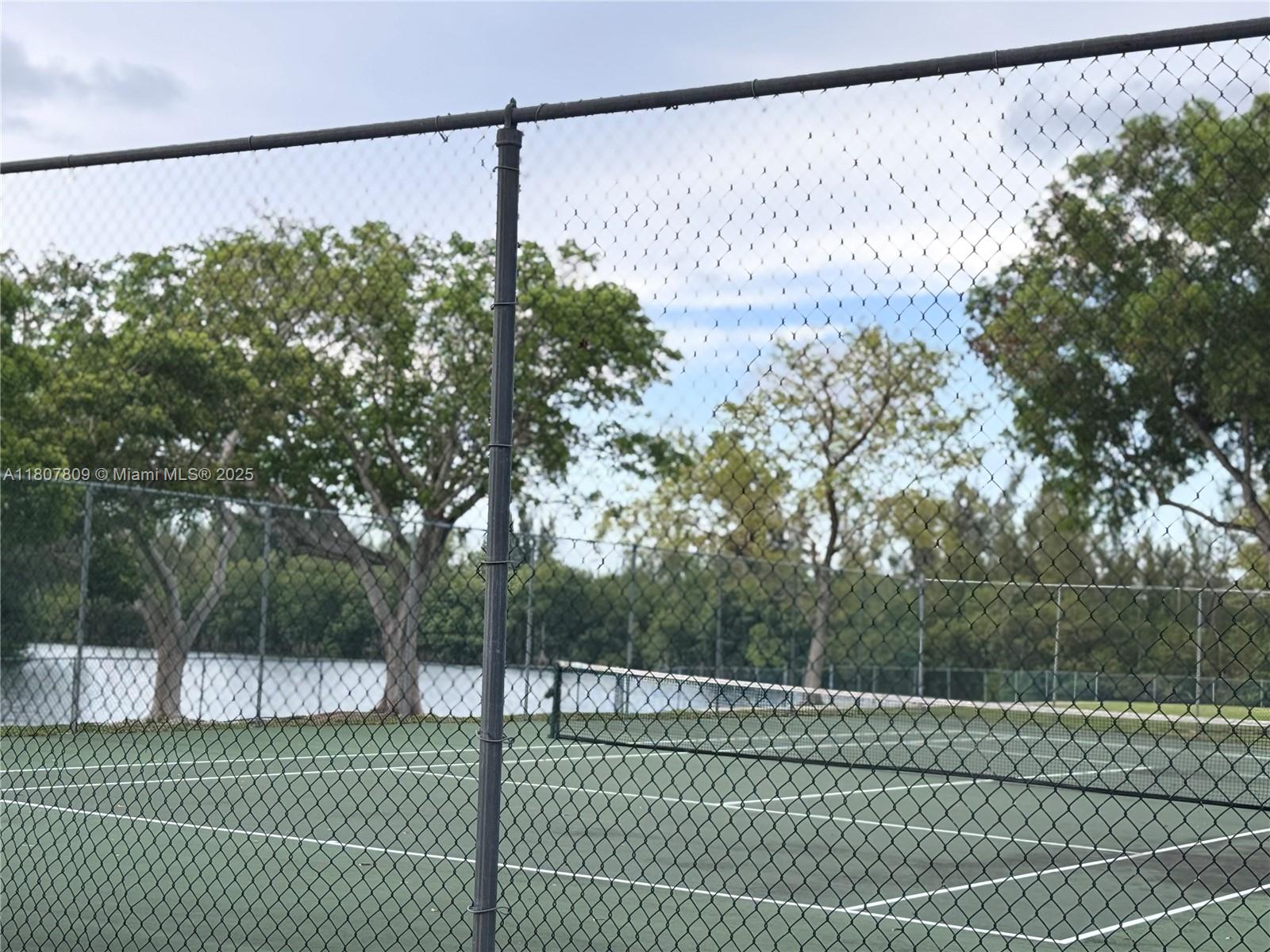 8260 Southwest 210th Street, Unit 310 Cutler Bay, FL 33189 - Photo 14 of 14 a view of a tennis court
