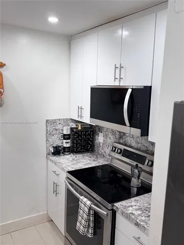 a kitchen with a stove and a microwave