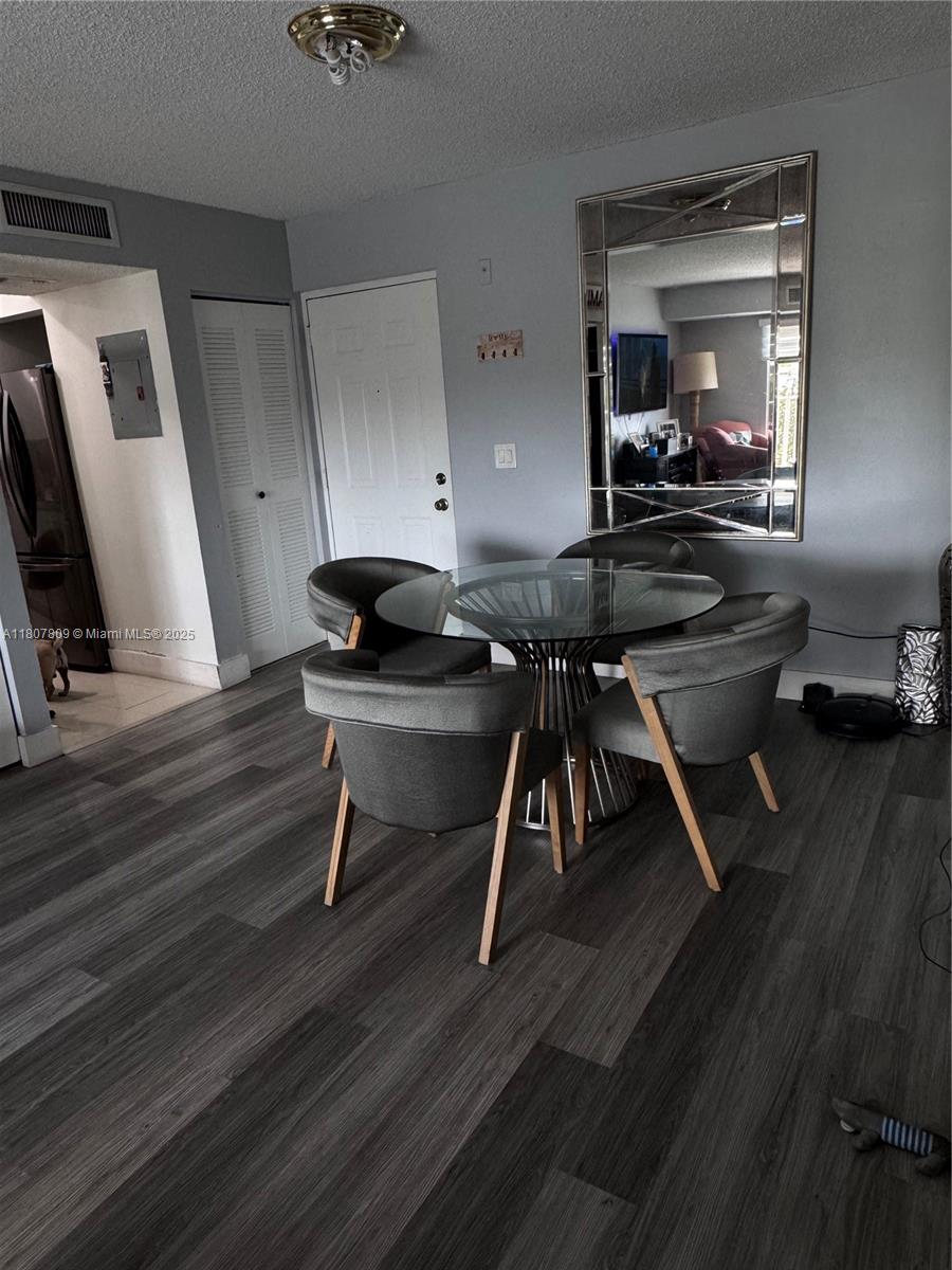 8260 Southwest 210th Street, Unit 310 Cutler Bay, FL 33189 - Photo 7 of 14 a workspace with wooden floor