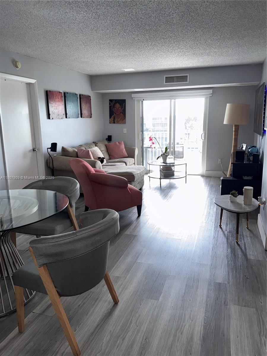 8260 Southwest 210th Street, Unit 310 Cutler Bay, FL 33189 - Photo 8 of 14 a living room with furniture and a large window