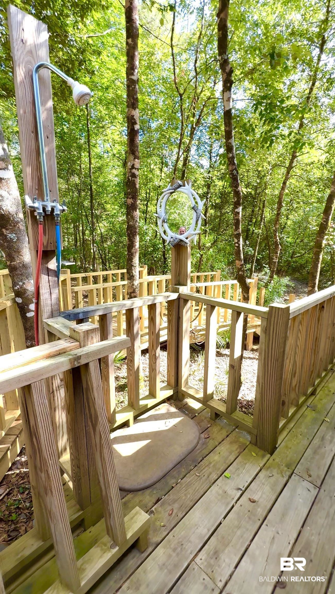 1 Mason Ferry Road Citronelle, AL 36522 - Photo 38 of 40 Outdoor shower station with wood deck flooring, wood railings, and natural surroundings