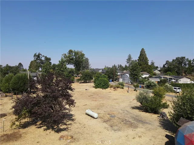 a view of a covered with snow in between of forest