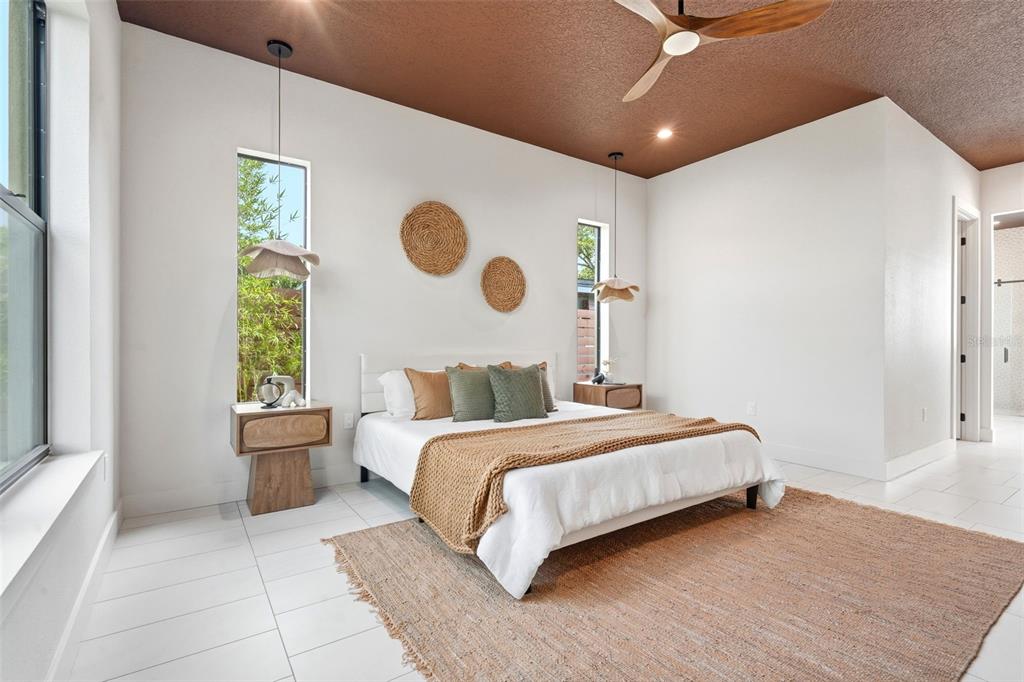 1615 Cole Road Orlando, FL 32803 - Photo 13 of 31 a bedroom with a bed and a large window