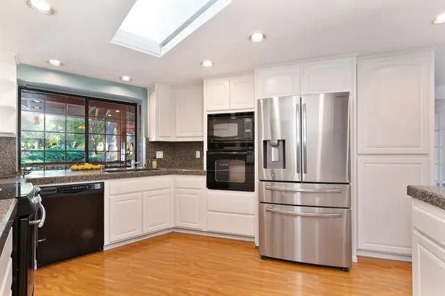 a kitchen with a stove and a sink