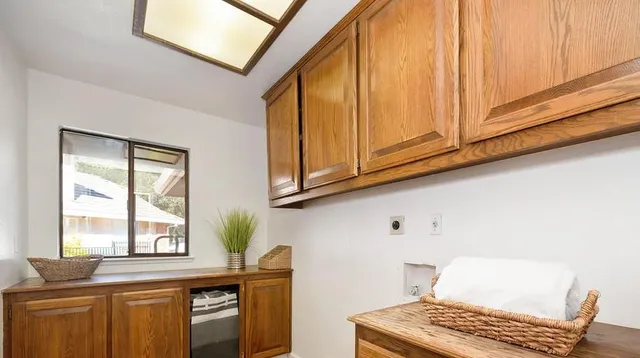 a view of a livingroom with a chandelier fan