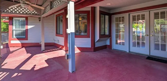 a view of empty room with floor to ceiling windows