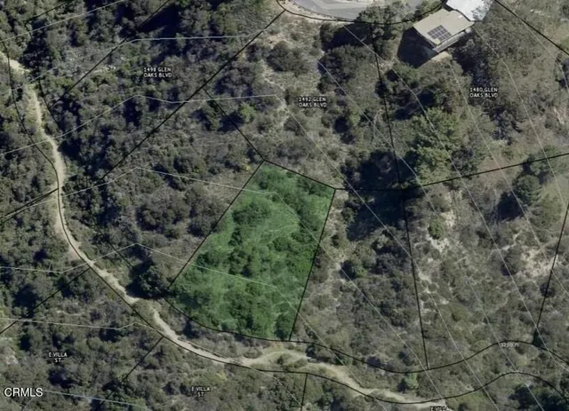 a view of a forest with a houses