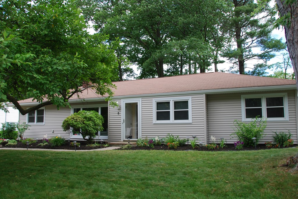 8 Sheffield Road Natick, MA 01760 - Photo 1 of 7 a front view of a house with a yard and potted plants