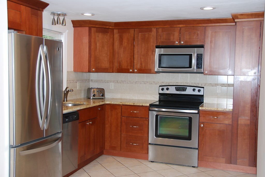 8 Sheffield Road Natick, MA 01760 - Photo 6 of 7 a kitchen with a refrigerator stove and microwave