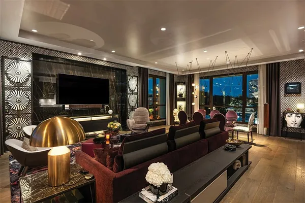 a kitchen with stainless steel appliances granite countertop a sink a stove and a wooden floors