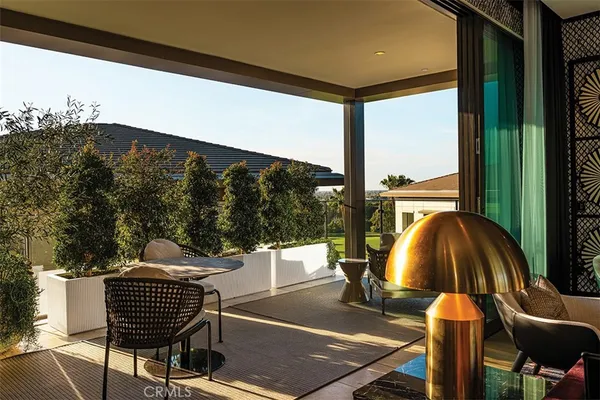 a outdoor dining space with furniture and a fireplace