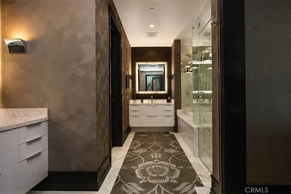 a bathroom with a tub and shower