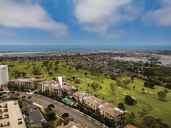 a living room with fireplace furniture and a large window