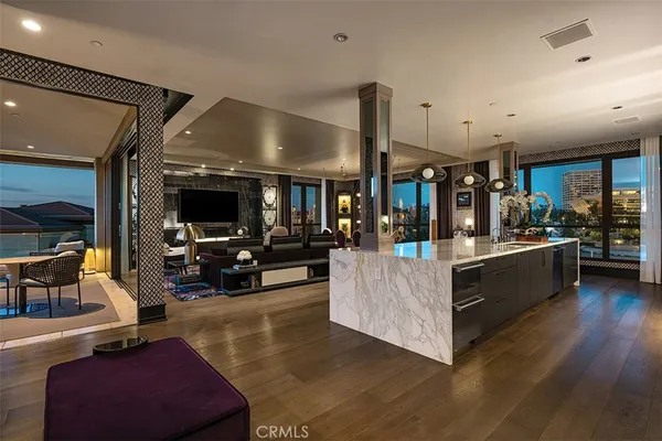 a kitchen with stainless steel appliances granite countertop a sink and stove