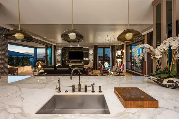 a kitchen with a sink cabinets and wooden floor