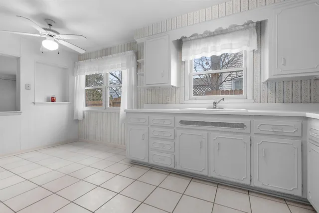 a bathroom with a sink vanity and mirror