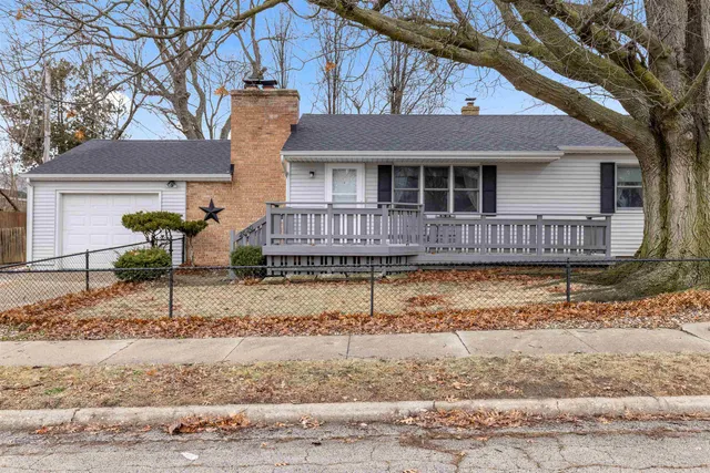 a front view of a house with garage