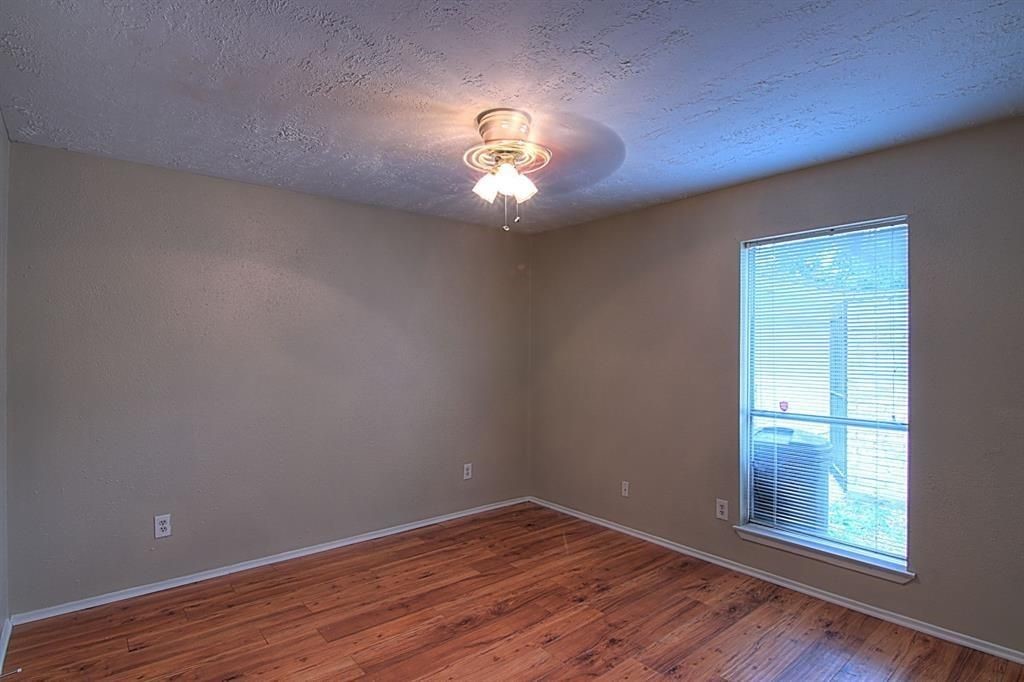 1111 Jack Block Court Crosby, TX 77532 - Photo 12 of 17 an empty room that has a window