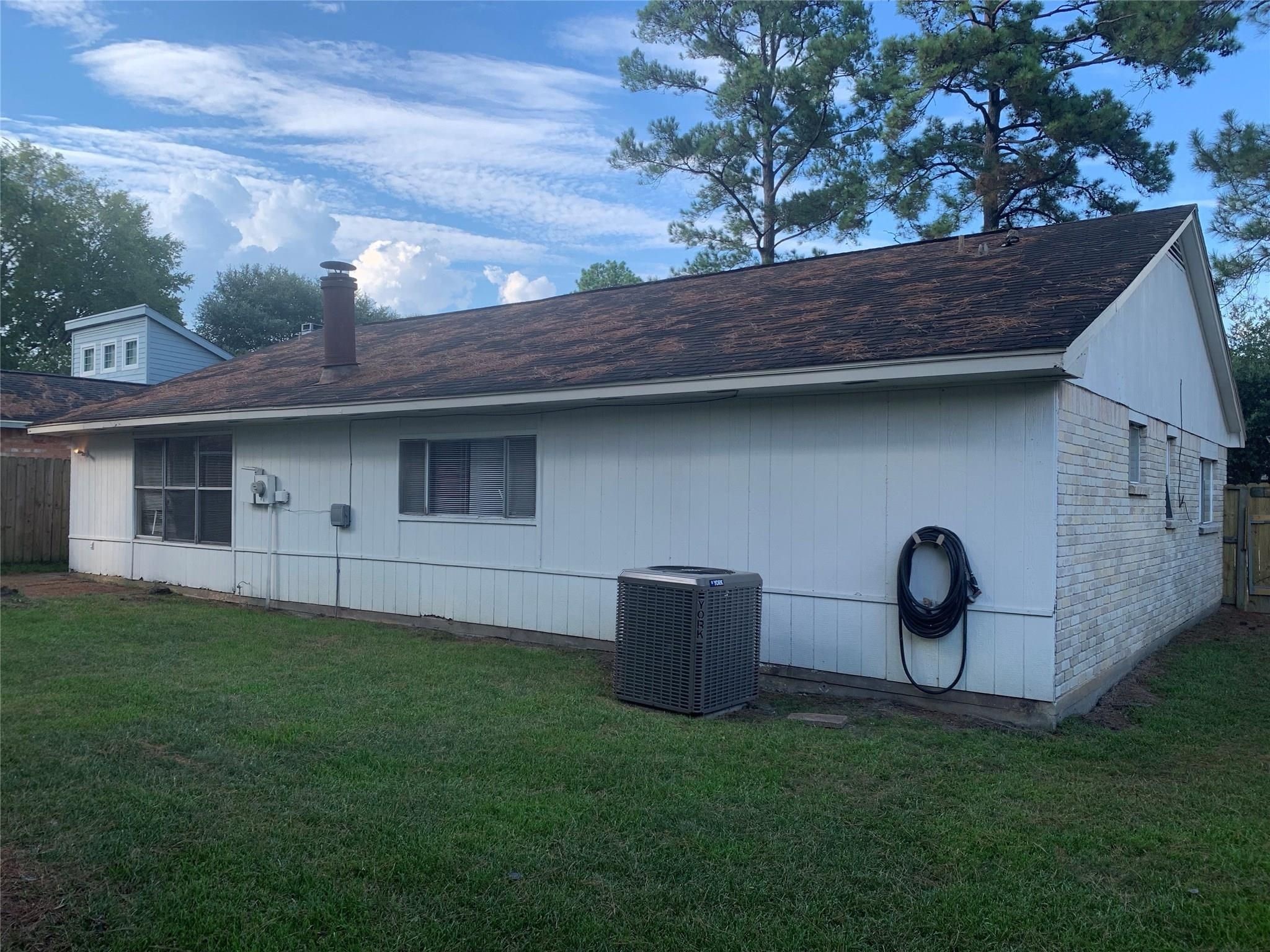 1111 Jack Block Court Crosby, TX 77532 - Photo 16 of 17 a backyard of a house with barbeque oven