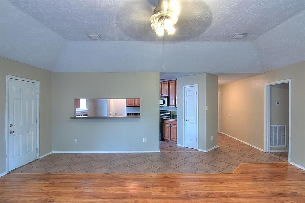 1111 Jack Block Court Crosby, TX 77532 - Photo 4 of 17 a view of a livingroom with a flat screen tv