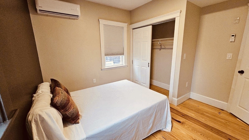 132 North Street, Unit 3 Salem, MA 01970 - Photo 12 of 19 a bedroom with a bed and a window