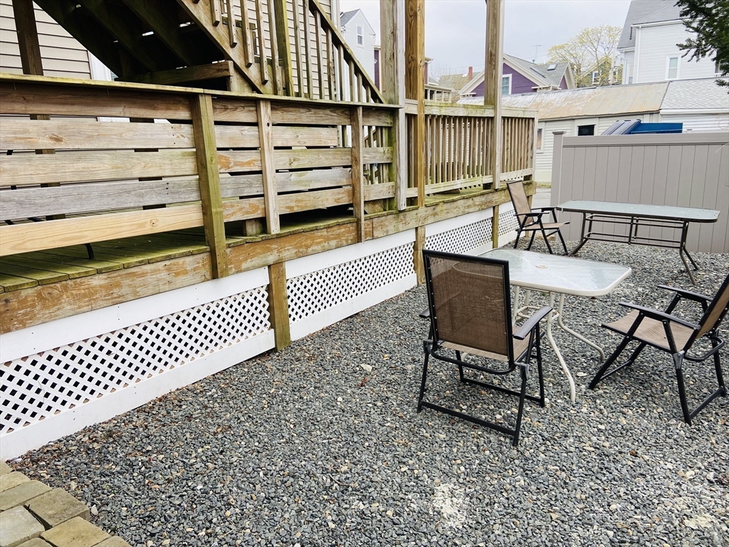 132 North Street, Unit 3 Salem, MA 01970 - Photo 17 of 19 a view of a chairs and table on the terrace