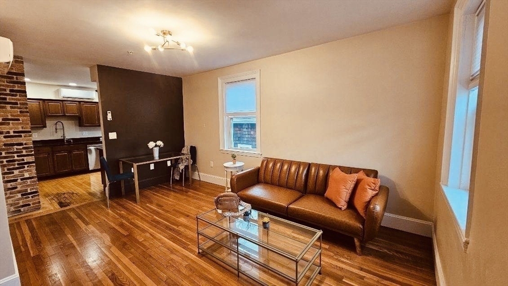 132 North Street, Unit 3 Salem, MA 01970 - Photo 2 of 19 a living room with furniture and a flat screen tv