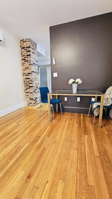 132 North Street, Unit 3 Salem, MA 01970 - Photo 3 of 19 a living room with furniture and wooden floor